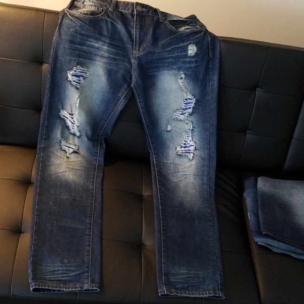 Distressed and repaired slim jeans